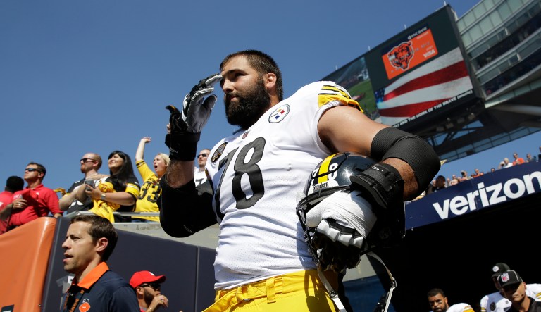 Pittsburgh Steelers offensive tackle and former Army Ranger Alejandro Villanueva stands outside the tunnel alone during the national anthem. (AP Photo/Nam Y. Huh)