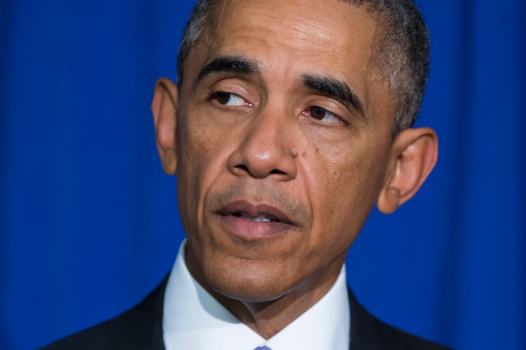 President Barack Obama delivers remarks at the Consumer Financial Protection Bureau, on Friday, Oct. 17, 2014, in Washington. Obama signed an executive order to improve security measures for government credit and debit cards. (AP Photo/Evan Vucci)