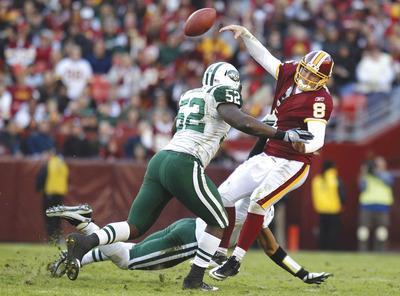 Evan Vucci/AP
Rex Grossman completed 19 of 46 passes for 221 yards and an interception as the Redskins'offense struggled after a good opening drive against the Jets on Sunday.