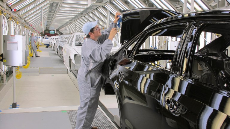 In a May 17, 2011 photo, Volkswagen employee Trina Galanto works on paint finish on a 2012 Passat at the automaker's plant in Chattanooga, Tenn. (AP File)