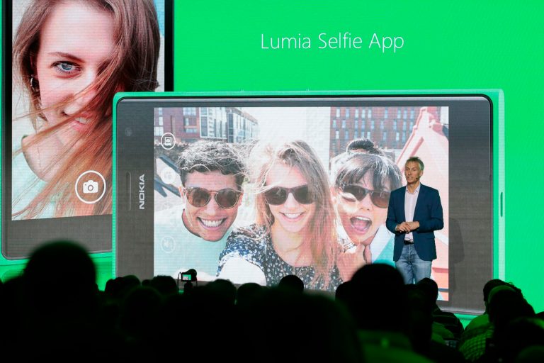 Chris Weber, CVP, Mobile Devices Sales of Microsoft,   presents the new Lumia Selfie App for their smart phones during his keynote speech  during  a Microsoft Nokia presentation event at the consumer electronic fair IFA in Berlin, Thursday, Sept. 4, 2014. (AP Photo/Markus Schreiber)