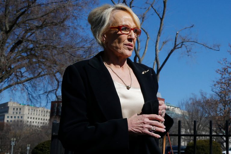 Arizona Gov. Jan Brewer walks towards the West Wing of the White House in Washington, Monday, Feb. 24, 2014, after the National Governors Association met with President Barack Obama. (AP Photo/Charles Dharapak)