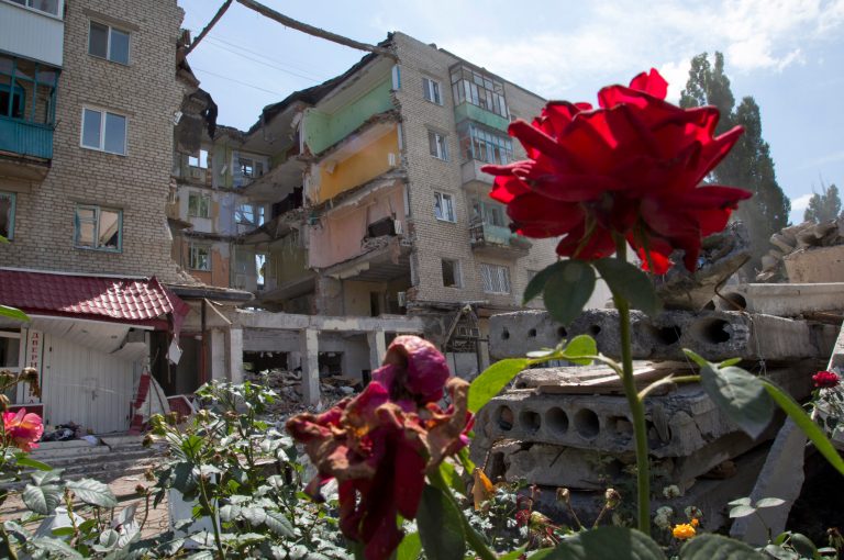 A building damaged by shelling is seen in Mikolaivka village, near the city of Slovyansk, Donetsk Region, eastern Ukraine Thursday, July 10, 2014. In the past two weeks, Ukrainian government troops have halved the amount of territory held by the rebels. Now they are vowing a blockade of Donetsk. In another sign of deteriorating morale among rebels, several dozen militia fighters in Donetsk abandoned their weapons and fatigues Thursday, telling their superiors they were returning home.(AP Photo/Dmitry Lovetsky)