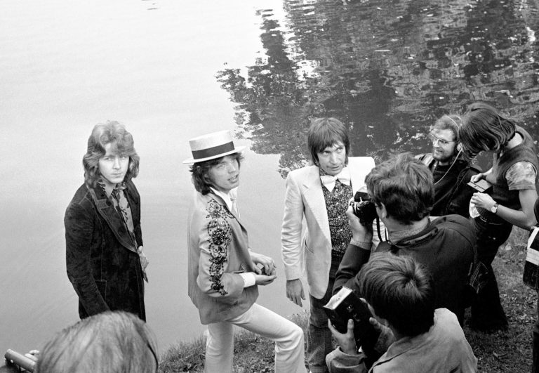   FILE - This Sept. 22 1970 file photo shows Mick Jagger, center, lead singer of The Rolling Stones pop music group, with a straw hat, as he and guitarist Mick Taylor and drummer Charlie Watts, right in bow tie, pose during a press conference at the Bois de Boulogne in Paris, France . In 1972, The Rolling Stones controversially moved to the south of France to escape onerous British taxes. Though it caused a stink at the time, it spawned one of the groupâs most seminal albums, âExile on Main St.â The title is a reference to their tax-dodging. (AP Photo, Cardenas, File)  