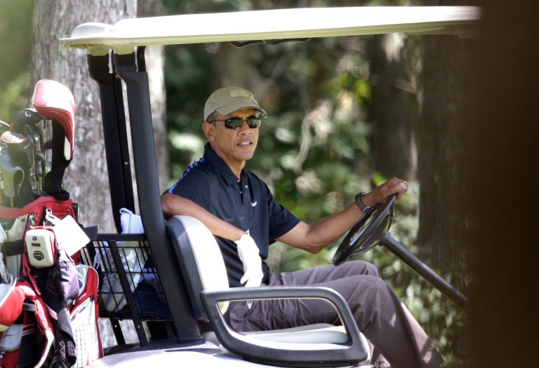 President Obama sits in a golf cart while golfing at Farm Neck Golf Club, in Oak Bluffs, Mass., on the island of Martha's Vineyard, Thursday. Obama is vacationing on the island. (AP Photo/Steven Senne)