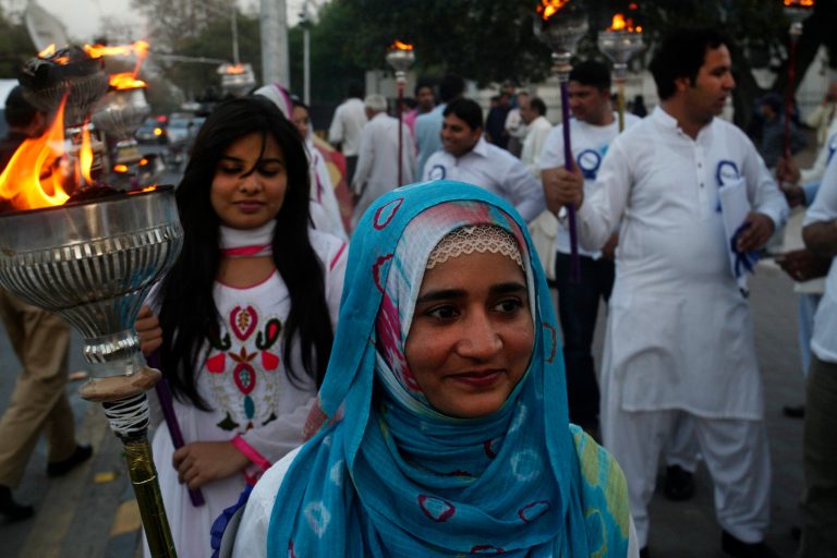 Pakistani peace activists rally to highlight the importance of tolerance in a peaceful society and demand concrete measures to deal the ongoing extremism and terrorism, in Lahore, Pakistan, Friday, April 11, 2014. (AP Photo/K.M. Chaudary)
