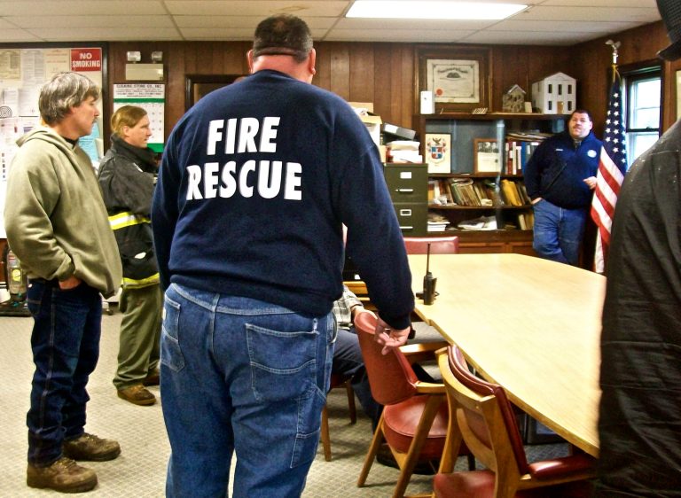First responders gather at a command post in Ephratah, N.Y., Saturday, May 25, 2013, as the search for the pilot of a downed Angel Flight out of Massachusetts continues. The twin engine light plane plane carrying two passengers and the pilot crashed in a wooded area in upstate New York on Friday. Angel Flight is a nonprofit group that arranges free air transportation for sick patients from volunteer pilots. (AP Photo/The Daily Gazette, Bethany Bump)