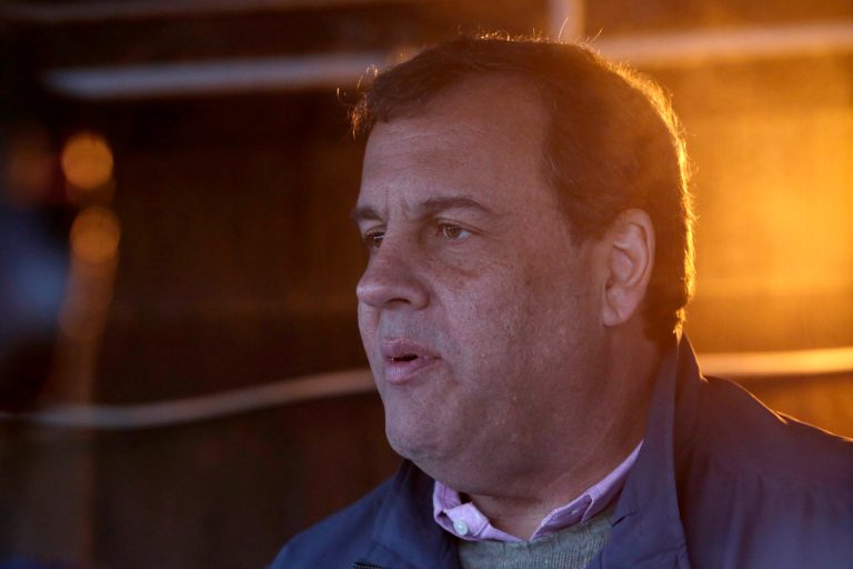New Jersey Gov. Chris Christie hands out a pre-Thanksgiving meal at the St. John's Church soup kitchen, Wednesday, Nov. 26, 2014, in Newark, N.J. Members of the Christie administration have been participating in their fourth annual 
