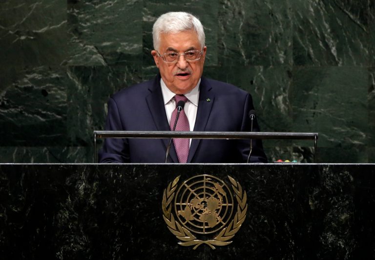 FILE - In this Friday, Sept. 26, 2014 file photo, President Mahmoud Abbas, of Palestine, addresses the 69th session of the United Nations General Assembly, at U.N. headquarters.  The Palestinians are asking the U.N. Security Council to set a deadline of November 2016 for an Israeli withdrawal from all Palestinian territory occupied since 1967 including East Jerusalem in a new push to achieve independence. The circulation of the draft resolution to council members follows Abbas' announcement to the U.N. General Assembly last Friday that he would ask the council to set a deadline for a pullout and dictate the ground rules for any talks with Israel.(AP Photo/Richard Drew, File)