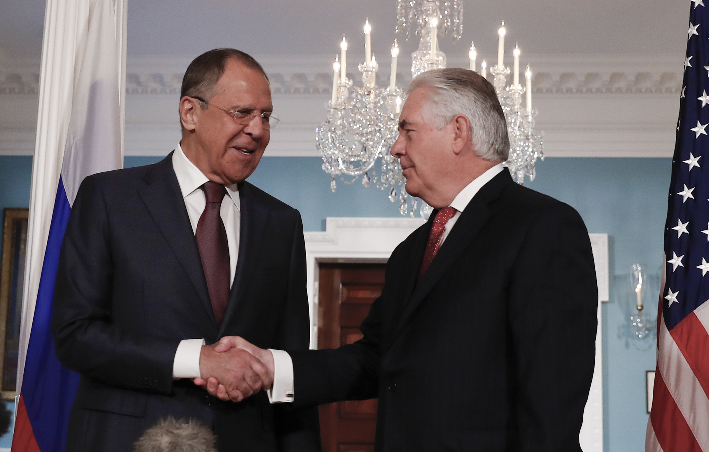 Rex Tillerson meets with Russian minister Sergey Lavrov for first time after Trump signed off on new sanctions