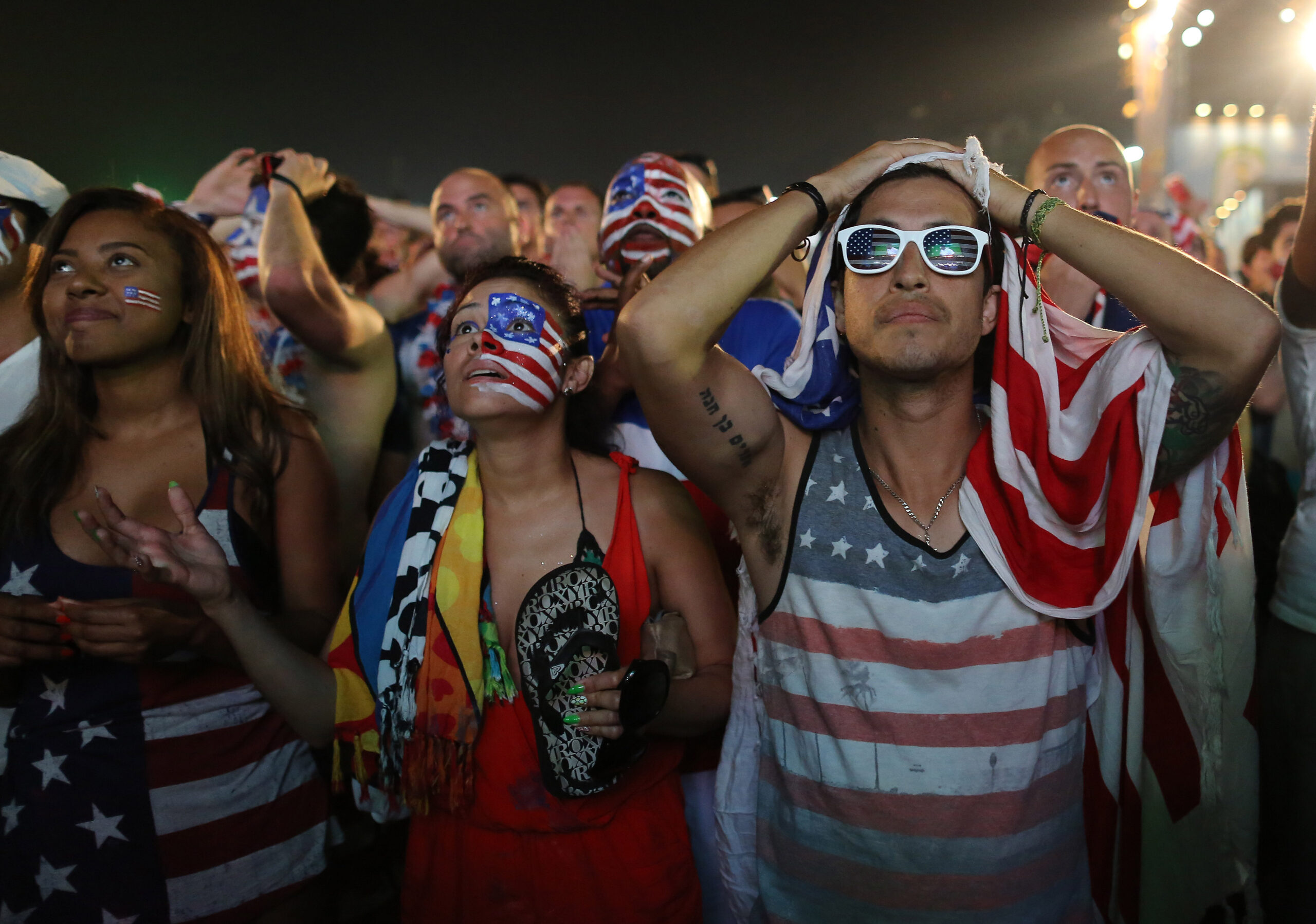 Long faces, but chins up for USA fans in Brazil