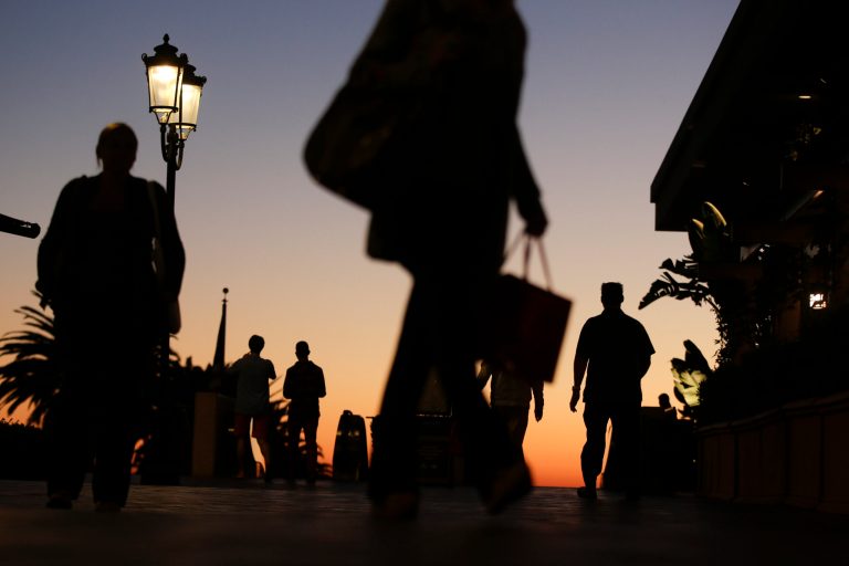   In this Thursday, Dec. 20, 2012 photo, people walk through the Fashion Island shopping center in Newport Beach, Calif. A confluence of factors has led to a muted approach to holiday shopping in 2012 - bad news for retailers, which can make up to 40 percent of annual sales during November and December and were counting on the last weekend before Christmas to make up for lost dollars earlier in the season. The Saturday before Christmas was expected to be the second biggest sales day behind the Friday after Thanksgiving. (AP Photo/Chris Carlson)  