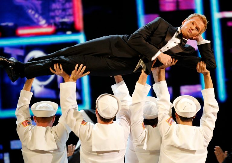 FILE - This June 12, 2011 file photo shows host Neil Patrick Harris performing during the 65th annual Tony Awards in New York. Harris will be back for his fourth turn as host of the Tony Awards. Producers of the show announced Thursday that Harris, a stage veteran and star of the CBS sitcom 