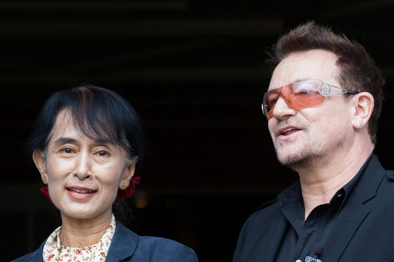   Irish singer and activist Bono and Myanmar's opposition leader Aung San Suu Kyi, left, pose for the media after attending a conference of the Oslo Forum at the Losby Gods resort, about 13 kilometers (8 miles) east of Oslo, Monday, June 18, 2012. The Oslo Forum is an international network of armed conflict mediation practitioners. (AP Photo/Markus Schreiber)  