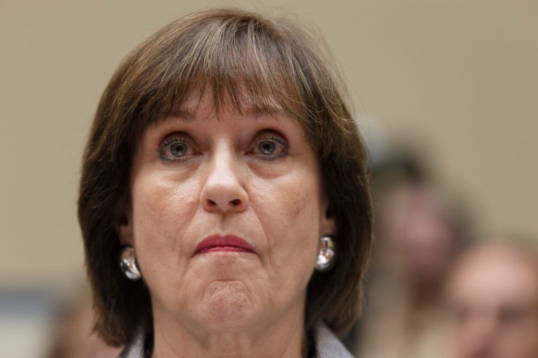 In this May 22, 2013 file photo, Internal Revenue Service official Lois Lerner refuses to answer questions as the House Oversight Committee holds a hearing to investigate the extra scrutiny the IRS gave Tea Party and other conservative groups that applied for tax-exempt status, on Capitol Hill in Washington. (AP Photo/J. Scott Applewhite, File)