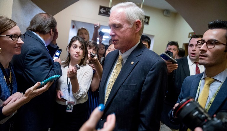 Sen. Ron Johnson, R-Wis., is pursued by reporters as he arrives on Capitol Hill in Washington, Tuesday, July 18, 2017. (AP Photo/Andrew Harnik)