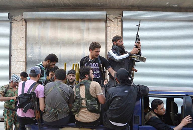   This citizen journalism image provided by Edlib News Network ENN, purports to show Syrian rebels gathered on their vehicle in the northern town of Kfar Nebel, in Idlib province, Syria, Tuesday, June 5, 2012. Rebel forces killed scores of Syrian soldiers in the past few days and activists claimed Tuesday the toll was more than 100 in what appeared to be some of the heaviest losses for government troops since the uprising began 15 months ago. (AP Photo/Edlib News Network ENN) THE ASSOCIATED PRESS IS UNABLE TO INDEPENDENTLY VERIFY THE AUTHENTICITY, CONTENT, LOCATION OR DATE OF THIS HANDOUT PHOTO  