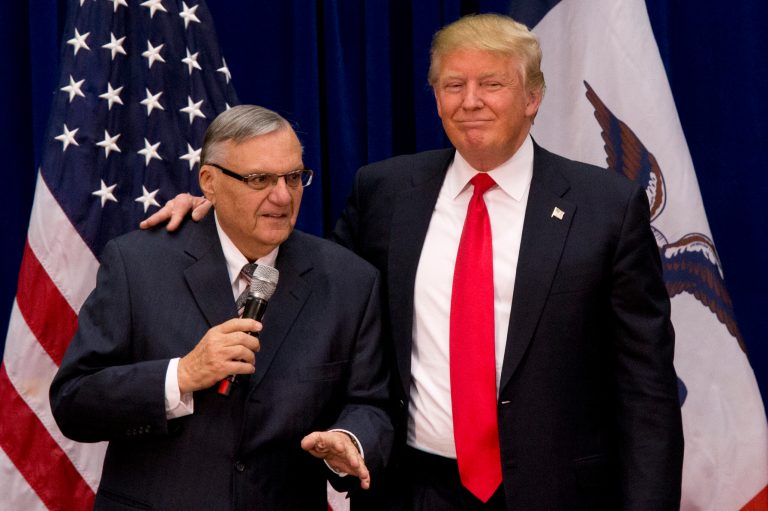 Republican presidential candidate Donald Trump is joined by Maricopa County, Ariz., Sheriff Joe Arpaio campaign event at the Roundhouse Gymnasium, Tuesday, Jan. 26, 2016, in Marshalltown, Iowa. (AP Photo/Mary Altaffer)
