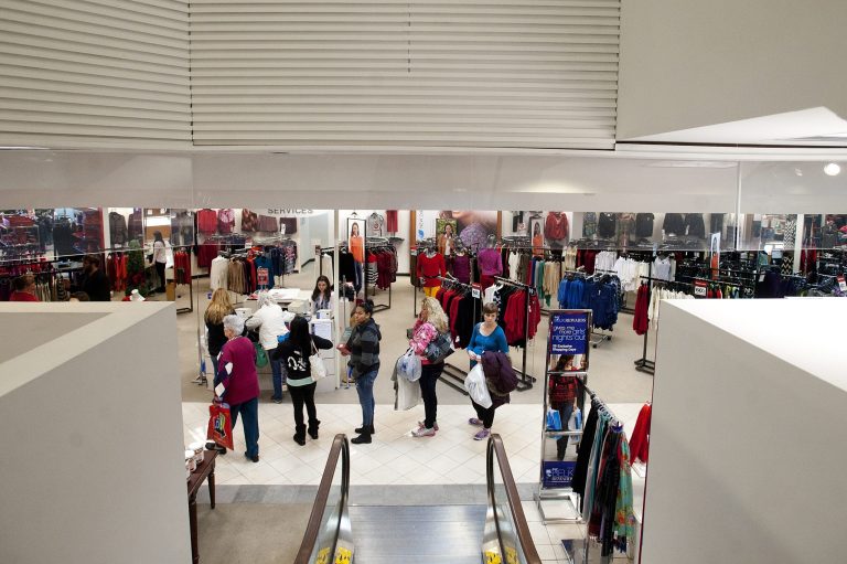FILE -In this Thursday, Dec. 26, 2013, file photo, people wait in line to at a customer service desk while shopping the day after Christmas, in Lynchburg, Va. The Federal Reserve reports on consumer borrowing in December on Friday, Feb. 7, 2014. (AP Photo/The News & Advance, Sam O'Keefe, File)