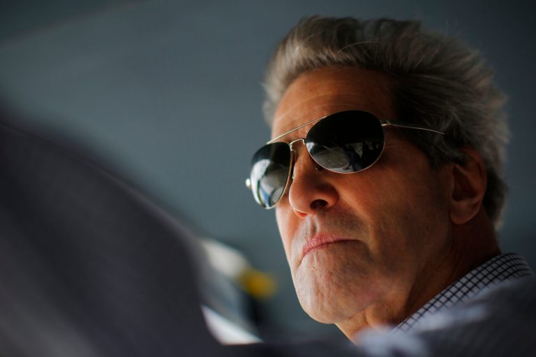 U.S. Secretary of State John Kerry rides a boat through the Mekong River Delta Sunday, Dec. 15, 2013. (AP Photo/Brian Snyder, Pool)