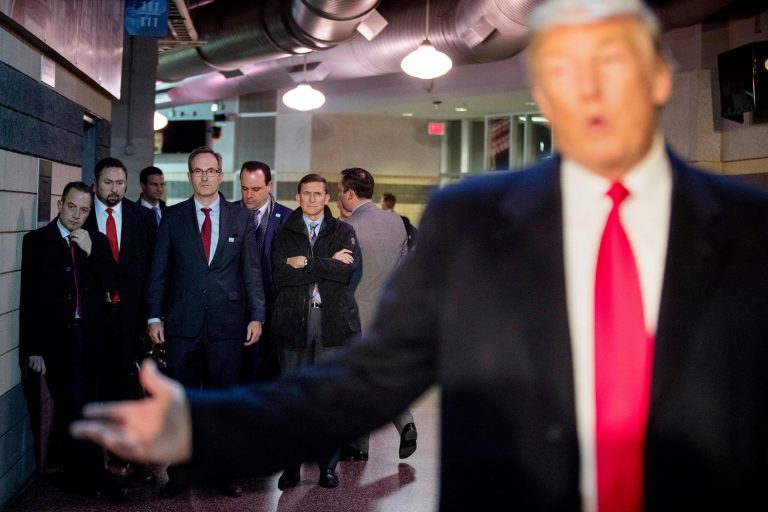 Donald Trump as president-elect in December 2018 with former Chief of Staff Reince Priebus, left; former advisor Jason Miller, second from left, and former spokesman Boris Epshteyn, fourth from left, and former national security advisor Michael Flynn. (AP Photo/Andrew Harnik)