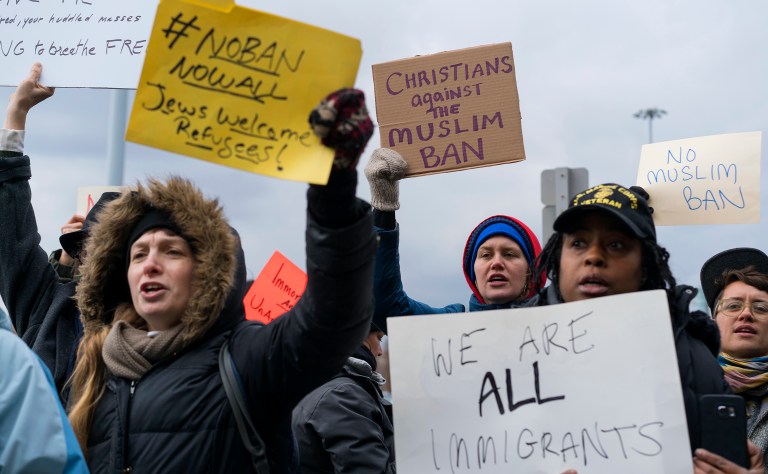 Protesters began assembling outside of JFK airport on Saturday. (AP Photo/Craig Ruttle)