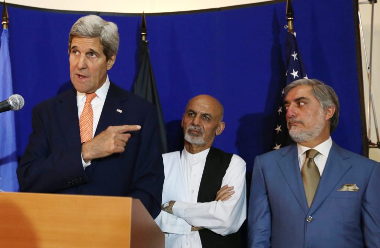FILE - In this  Friday, Aug. 8, 2014 file photo, U.S. Secretary of State John Kerry, left, speaks as Afghan presidential candidates Ashraf Ghani Ahmadzai, center, and Abdullah Abdullah listen during a joint press conference in Kabul, Afghanistan. 