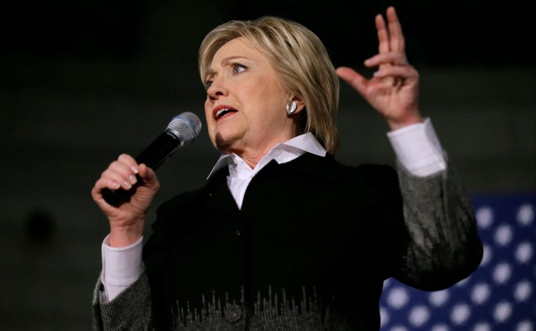 Clinton will take the debate stage hoping to prove she still has momentum after her loss in Michigan. (AP Photo/Charlie Neibergall)