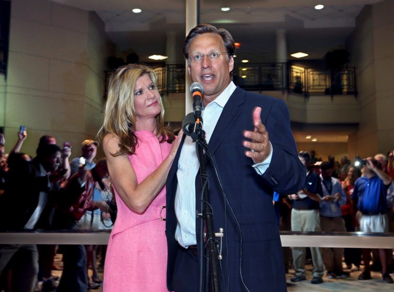 Dave Brat, stands his wife, Laura, as he speaks to supporters after defeating Republican Congressman Eric Cantor in the Republican primary for the 7th Congressional District in Virginia on Tuesday, June 10, 2014 in Henrico, Va. (AP Photo/Richmond Times-Dispatch, P. Kevin Morley)