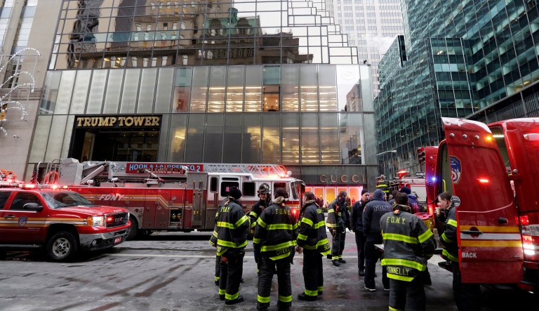 New York City Fire Department vehicles sit on Fifth Avenue in front of Trump Tower, in New York, Monday, Jan. 8, 2018. The department says the fire started around 7 a.m. Monday in the heating and air conditioning system of the building on Fifth Avenue in Manhattan. (AP Photo/Richard Drew)