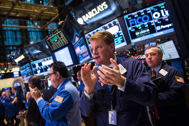 Traders work on the floor of the New York Stock Exchange during the afternoon of December 18, 2014 in New York City. (Photo by Andrew Burton/Getty Images)