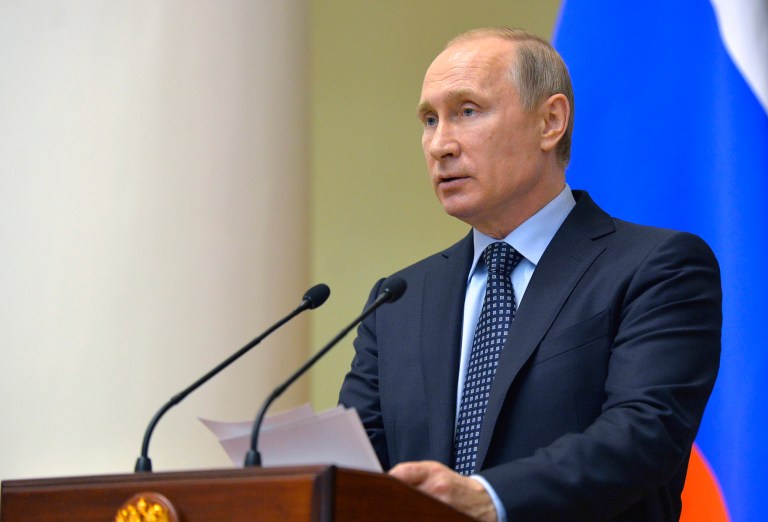 Russian President Vladimir Putin's annexation of Crimea recalls the Soviet occupation of Eastern European states during the Cold War and demands that the U.S. impose new sanctions, according to lawmakers. (Alexei Druzhinin/Sputnik, Kremlin Pool Photo via AP)