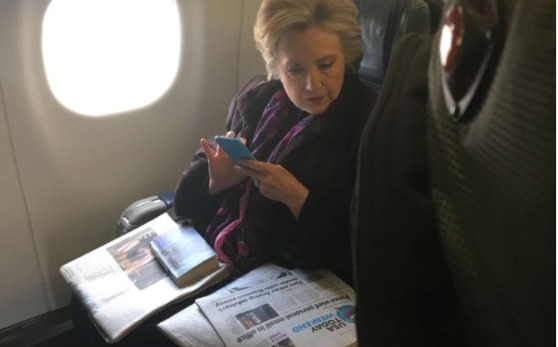 Hillary Clinton was caught on camera apparently looking at a newspaper article about Vice President Mike Pence's personal email account that was hacked. (Photo courtesy of Twitter)