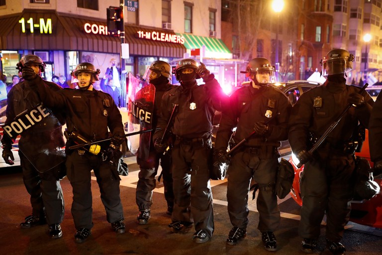 Two hundred people were charged with crimes related to rioting downtown Washington. Six police officers were injured while on duty. (AP Photo/John Minchillo)