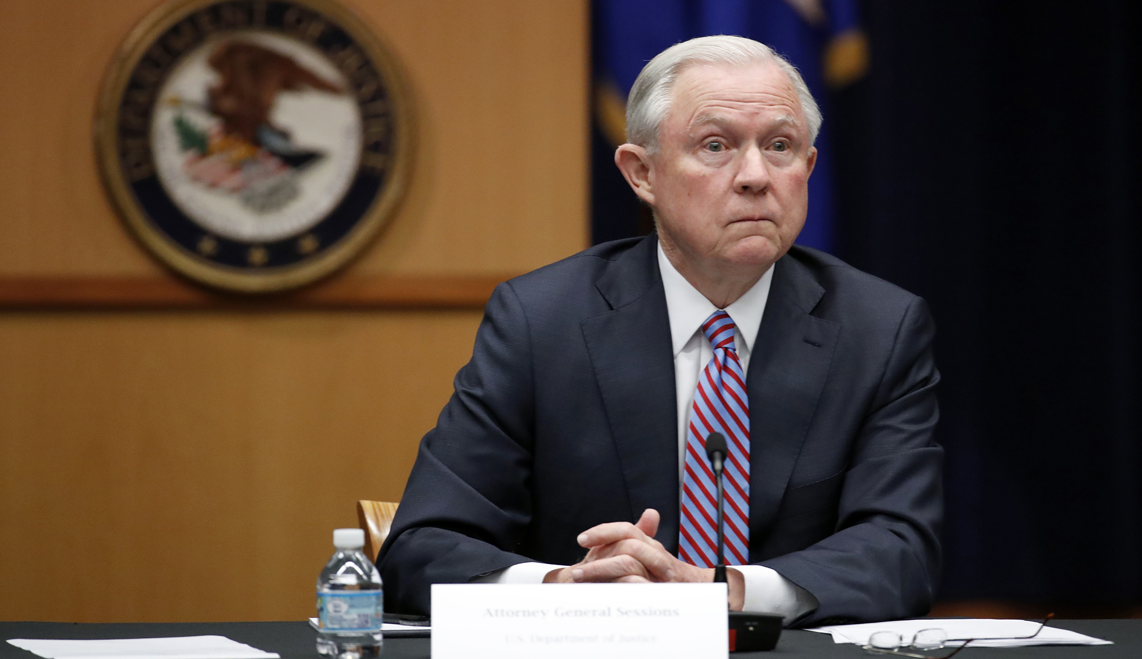 ‘#FireSessions’ projected on Justice Department building