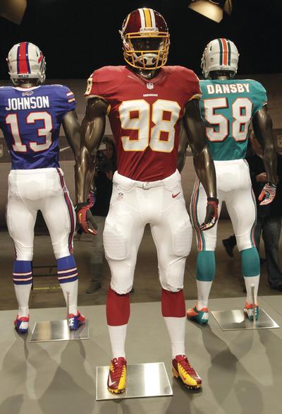 Seth Wenig/AP
The new Washington Redskins uniform is displayed on a mannequin in New York on Tuesday.