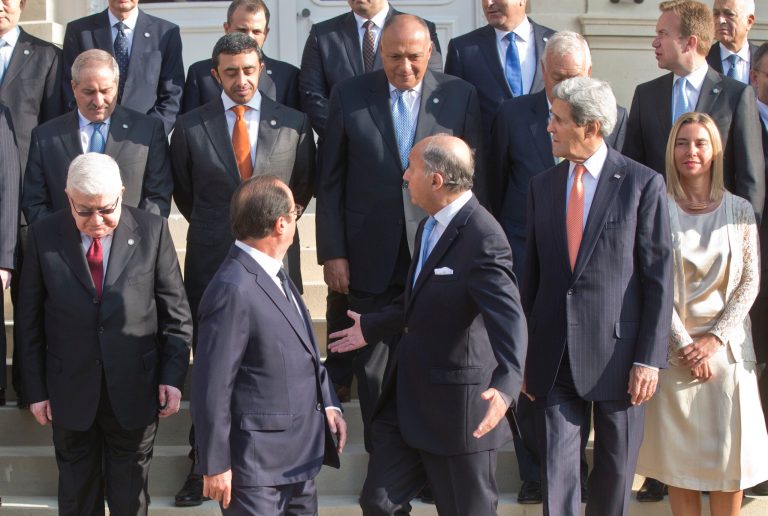 Top from left, Jordanian Foreign Minister, Sheikh Sabah Khaled al Hamad, Foreign Minister of United Arab Emirats sheik Abdullah Bin Zayed al Nahyan, unidentified, Spanish Foreign Minister Jose Manuel Garcia-Margallo, Norwegian Foreign Borge Brendem,  front row from left, Iraqi President Fouad Massoum, French President Francois Hollande, French Foreign Minister Laurent Fabius  U.S. Secretary of State  John Kerry, and Italian Foreign Minister Federica Mogherini  prepare to walk away after a group photo at the French Foreign ministry in Paris, Monday Sept. 15, 2014, prior to a meeting on the Islamic State group. Diplomats from around the world are in Paris pressing for a coherent global strategy to combat extremists from the Islamic State group. (AP Photo/Michel Euler, Pool)