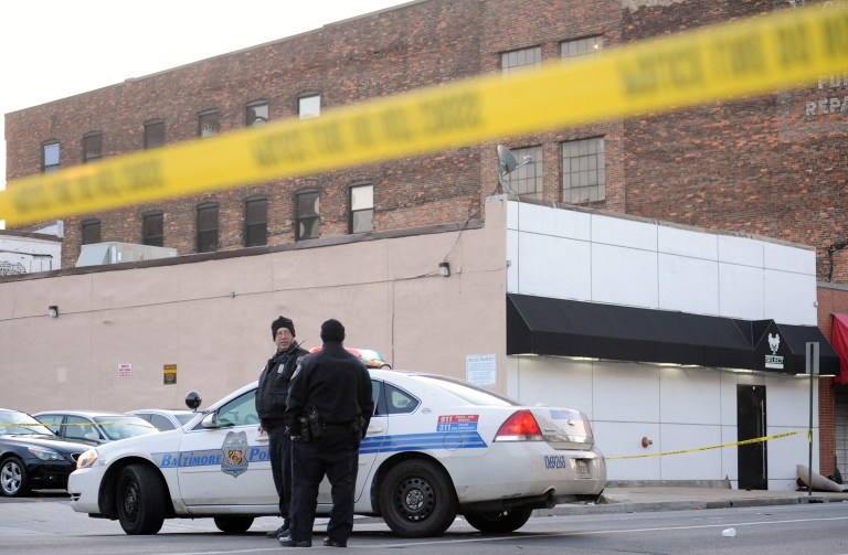 The memorial service for a victim of gun violence became a crime scene Monday. (AP Photo/Steve Ruark)