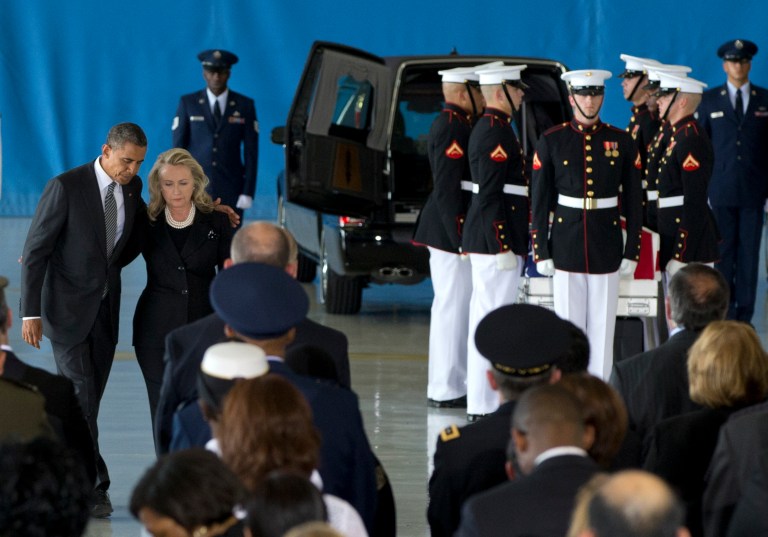 FILE - In this Sept. 14, 2012 file photo, President Barack Obama and Secretary of State Hillary Rodham Clinton walk back to their seats during the Transfer of Remains Ceremony at Andrews Air Force Base, Md., marking the return to the United States of the remains of the four Americans in Benghazi, Libya. Newly revealed testimony from top military commanders involved in the U.S. response to the Benghazi attacks suggests that the perpetrators of a second, dawn attack on a CIA complex probably were different from those who penetrated the U.S. diplomatic mission the evening before and set it ablaze, killing Ambassador Chris Stevens and another American. The second attack, which killed two security contractors, showed clear military training, retired Gen. Carter Ham told Congress in closed-door testimony. (AP Photo/Carolyn Kaster)