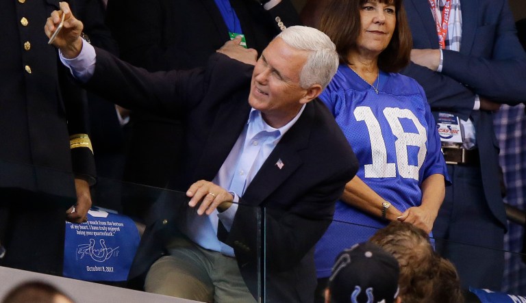 Vice President Mike Pence takes a photo with a fan before an NFL football game between the Indianapolis Colts and the San Francisco 49ers, Sunday, Oct. 8, 2017, in Indianapolis. (AP Photo/Michael Conroy)
