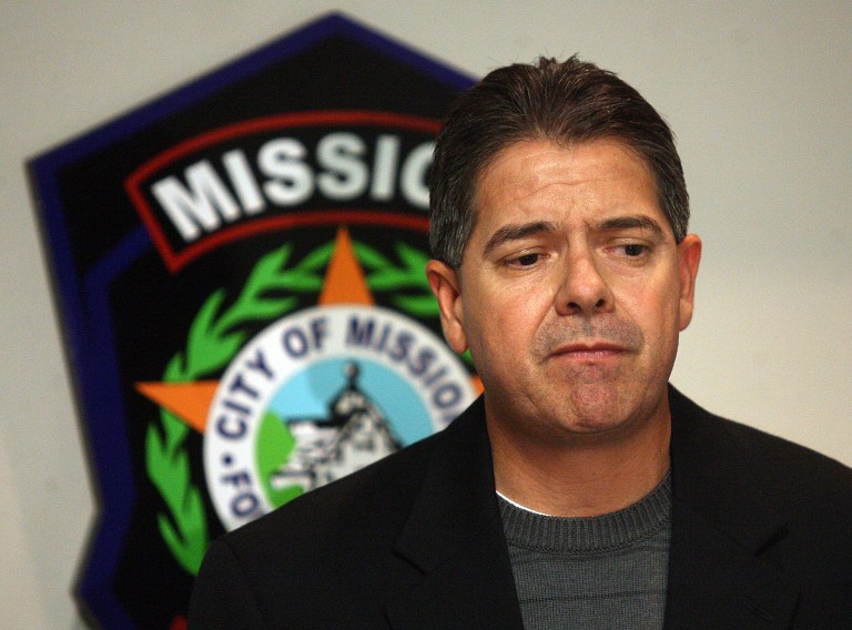   In this Wednesday, Dec. 12, 2012 photo, Mission Police Chief Martin Garza speaks to the media during a news conference at Mission Police Department in Mission, Texas. Three South Texas lawmen, including the son of a prominent county sheriff, will likely spend the weekend in custody on charges alleging that they and another officer accepted thousands of dollars in bribes to guard shipments of cocaine. Federal agents Wednesday arrested Jonathan Trevino, son of Hidalgo County Sheriff Lupe Trevino, and Alexis Espinoza, son of Hidalgo Police Chief Rudy Espinoza, three area law enforcement officials confirmed. (AP Photo/The Monitor, Joel Martinez)  