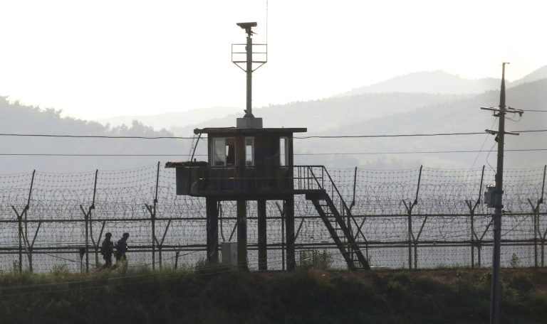 South Korean army soldiers patrol along the barbed-wire fence in South Korea's Paju, near the border with North Korea, Monday, Aug. 7, 2017. North Korea vowed Monday to bolster its nuclear arsenal and launch 