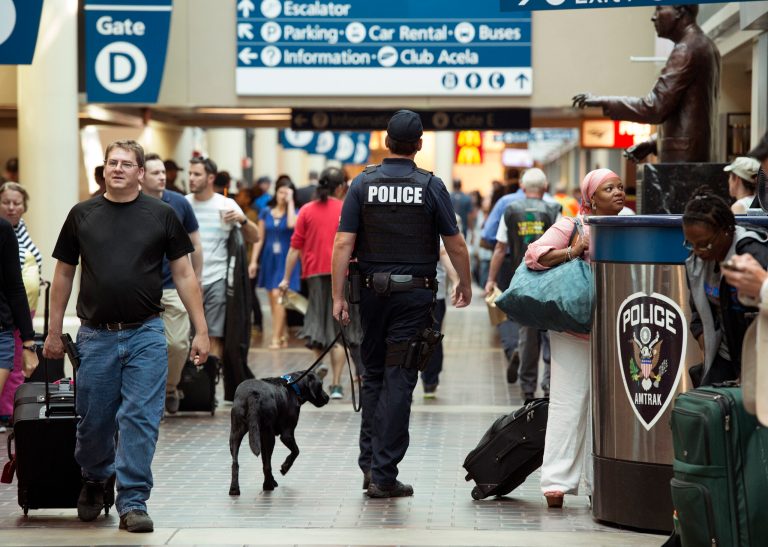 An police officer with a canine patrols Union Station in Washington, Thursday, Sept. 3, 2015. (AP Photo/Molly Riley)