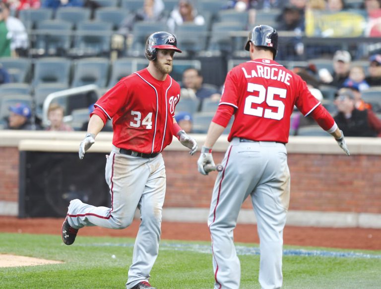 Peter Morgan/AP
Bryce Harper hit two home runs, including the game-winner in the eighth inning, as the Nationals beat the Mets on Saturday.