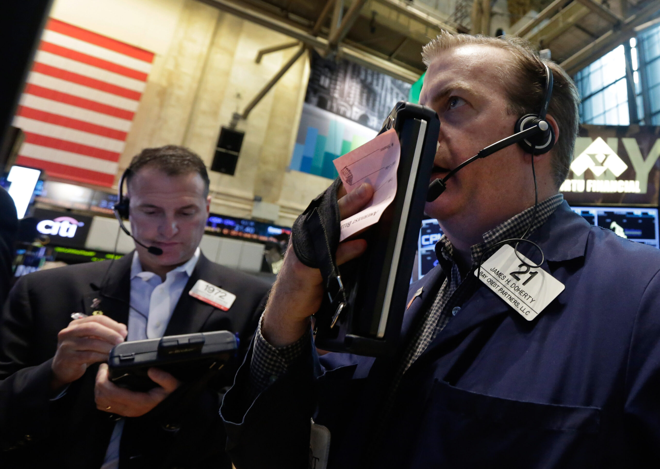 Dow average creeps to a record-high close