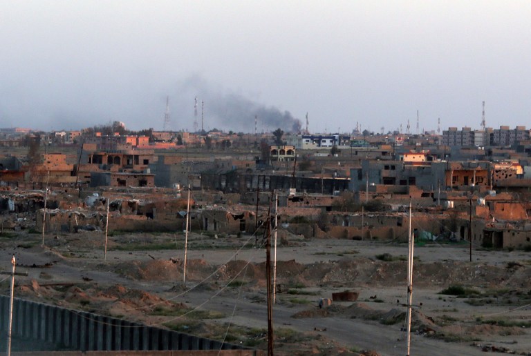 In the current battle for control in Tikrit, Iraq, the U.S. finds itself on the sidelines. [AP Photo]Â 