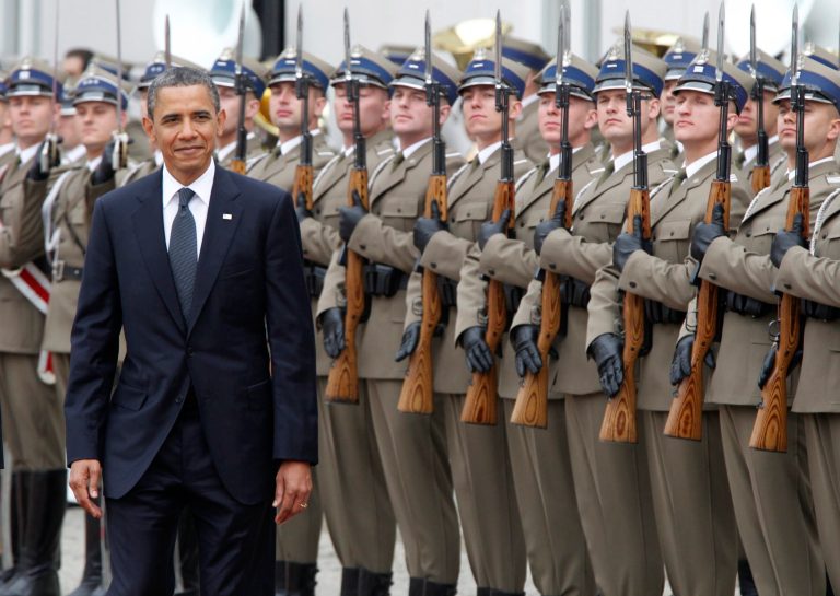 FILE - This May 28, 2011, file photo shows U.S. President Barack Obama during an arrival ceremony at the presidential palace in Warsaw, Poland. Monday, June 2, 2014, Obama begins a four-day trip to Poland, Belgium, and France against the backdrop of successful national elections in Ukraine. He will likely press European leaders to maintain pressure on Russia for its threatening moves in Ukraine, while seeking to dispel fears from Poland and other NATO allies that the West could slip back into a business-as-usual relationship with Moscow. (AP Photo/Charles Dharapak, File)