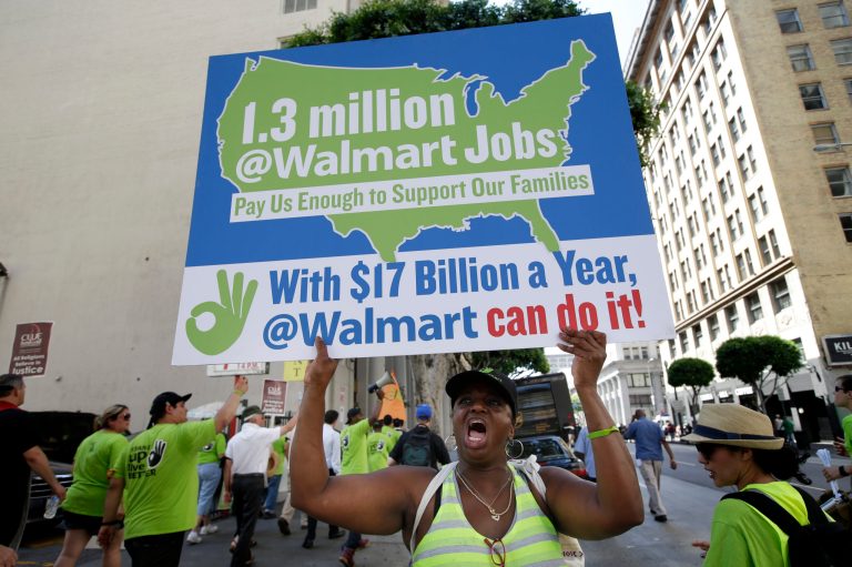 A women chants her slogans while marching along the street during a protest against Walmart on Sept. 5 in Los Angeles. (AP/Jae C. Hong)