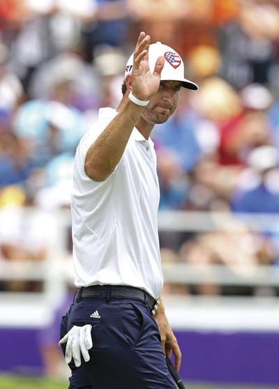 Andy Lyons/Getty Images
Dustin Johnson birdied two of the last three holes to win the St. Jude Classic on Sunday.