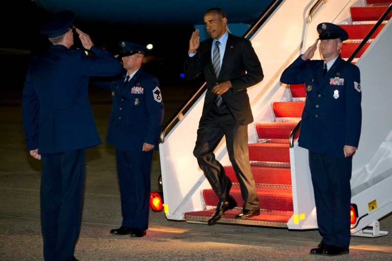 President Barack Obama salutes as he exits Air Force One as he returns to Andrews Air Force Base, Md., Thursday, July 17, 2014, after stops in Delaware and New York. (AP Photo/Jacquelyn Martin)
